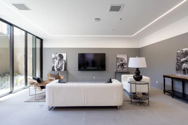 a living room with furniture and a lamp