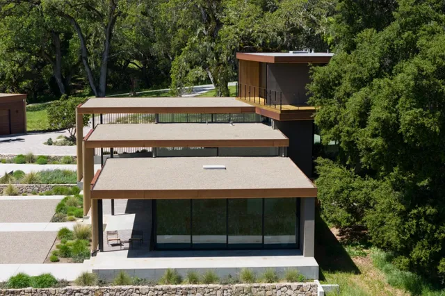a view of a house with yard and sitting area