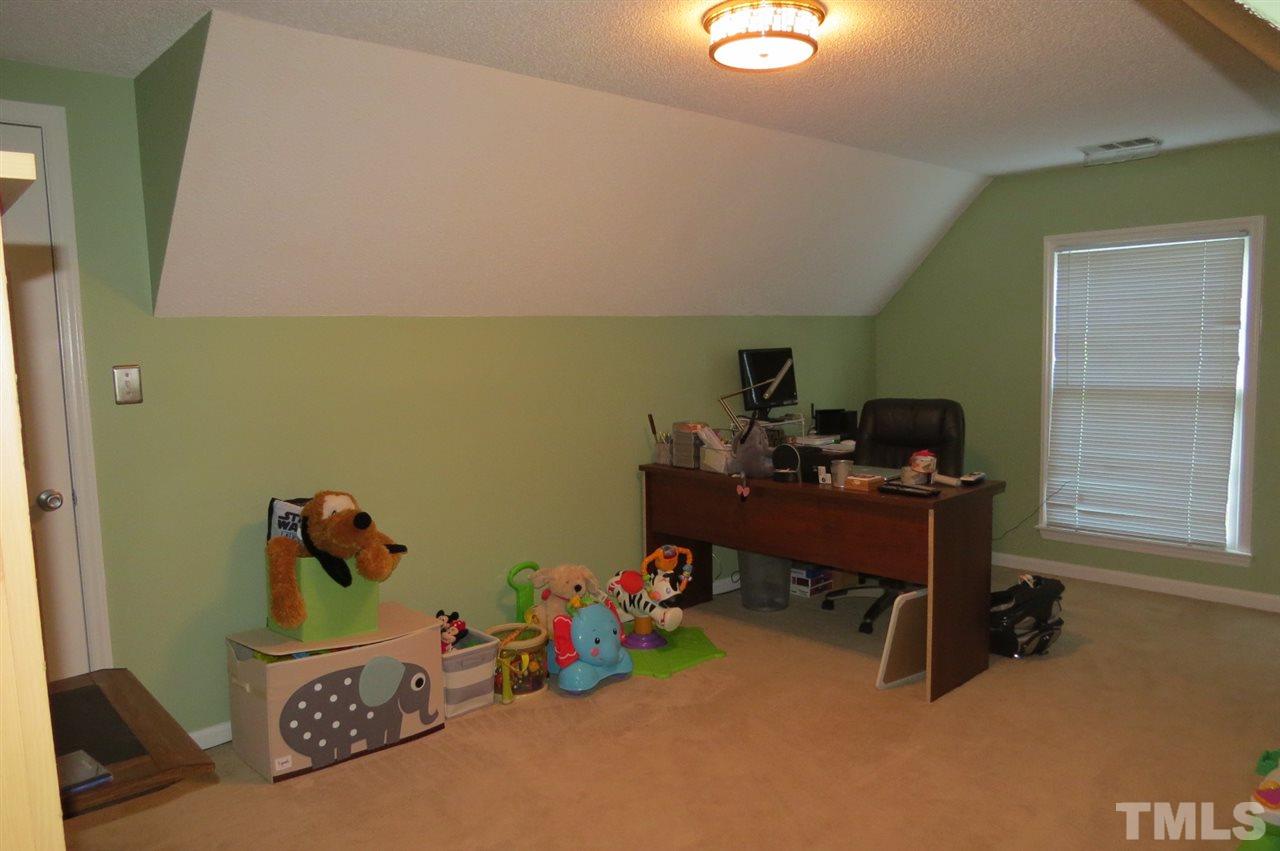 5417 Ingate Way Raleigh, NC 27613 - Photo 13 of 16 a room with toys and stairs