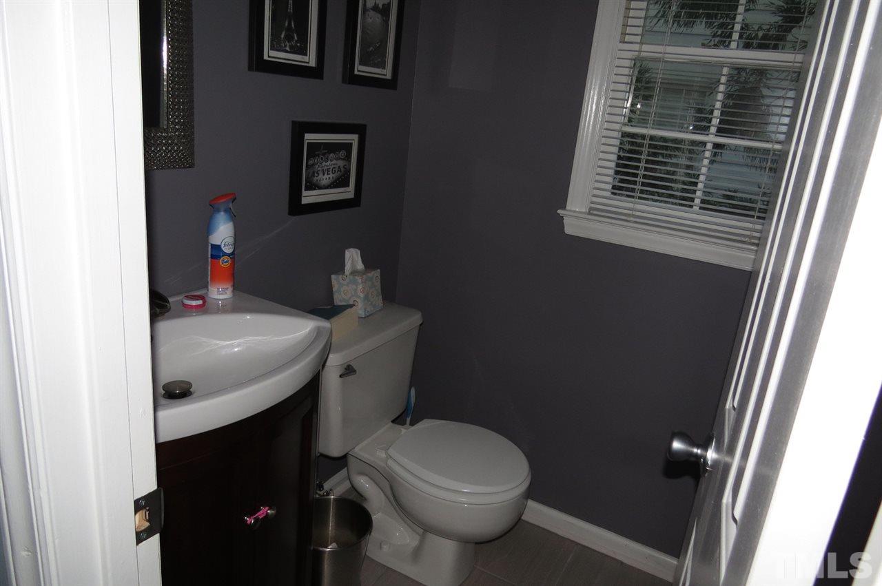 5417 Ingate Way Raleigh, NC 27613 - Photo 7 of 16 a bathroom with a toilet and a sink