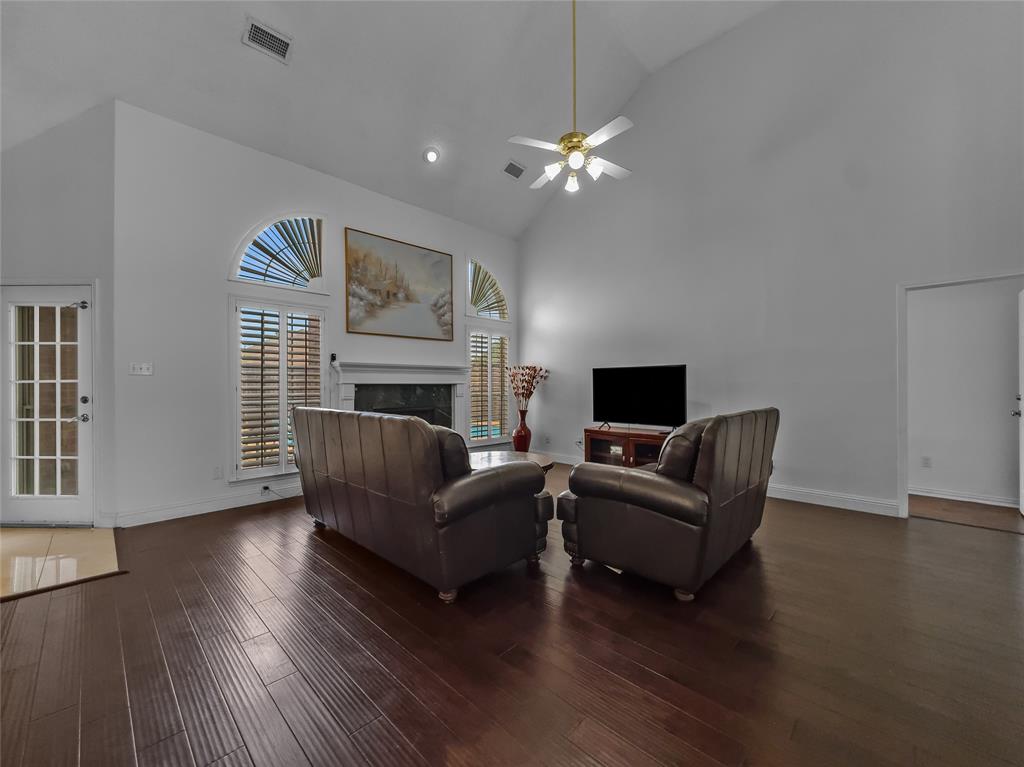 2317 Wellesly Road Rowlett, TX 75089 - Photo 12 of 39 a living room with furniture and a fireplace