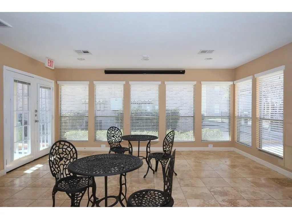 17310 Kieth Harrow Boulevard, Unit 510 Houston, TX 77084 - Photo 11 of 20 a living room with furniture and a large window