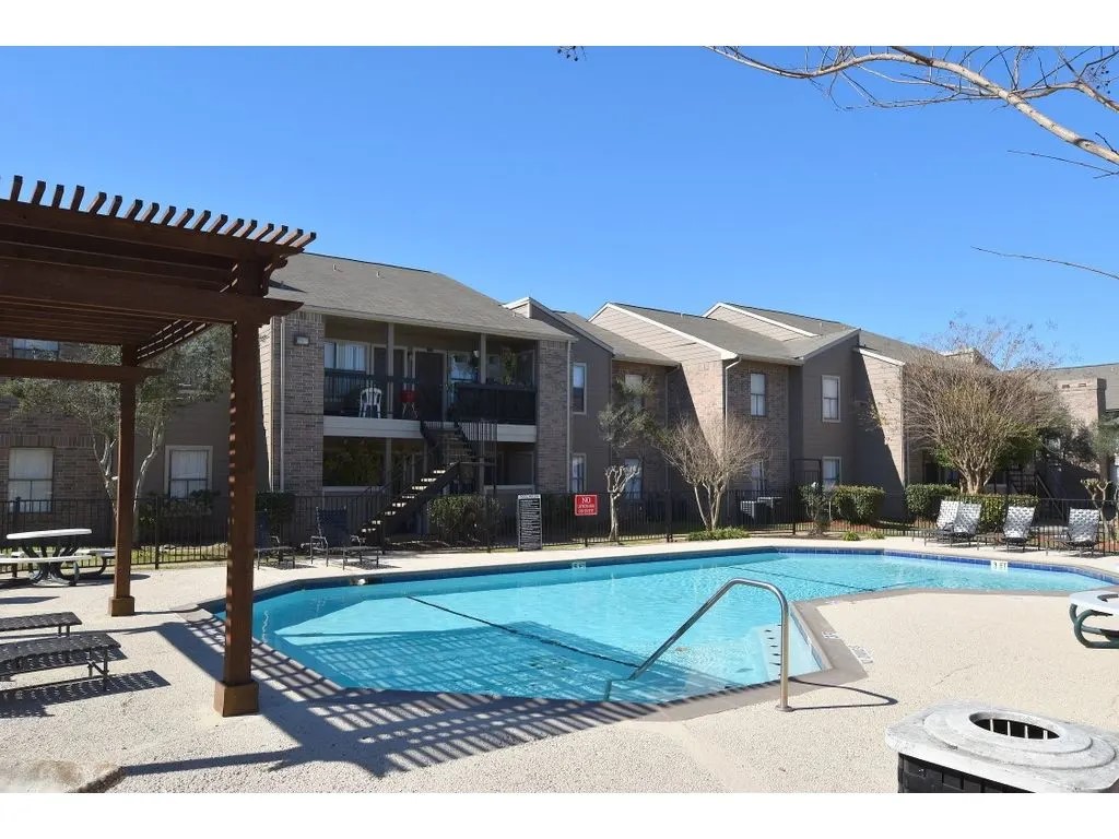 17310 Kieth Harrow Boulevard, Unit 510 Houston, TX 77084 - Photo 2 of 20 a view of a house with swimming pool and a yard