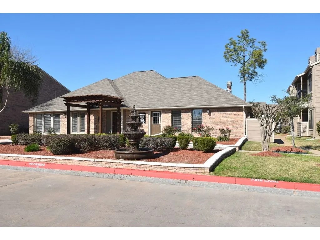 17310 Kieth Harrow Boulevard, Unit 510 Houston, TX 77084 - Photo 4 of 20 a front view of a house with a yard