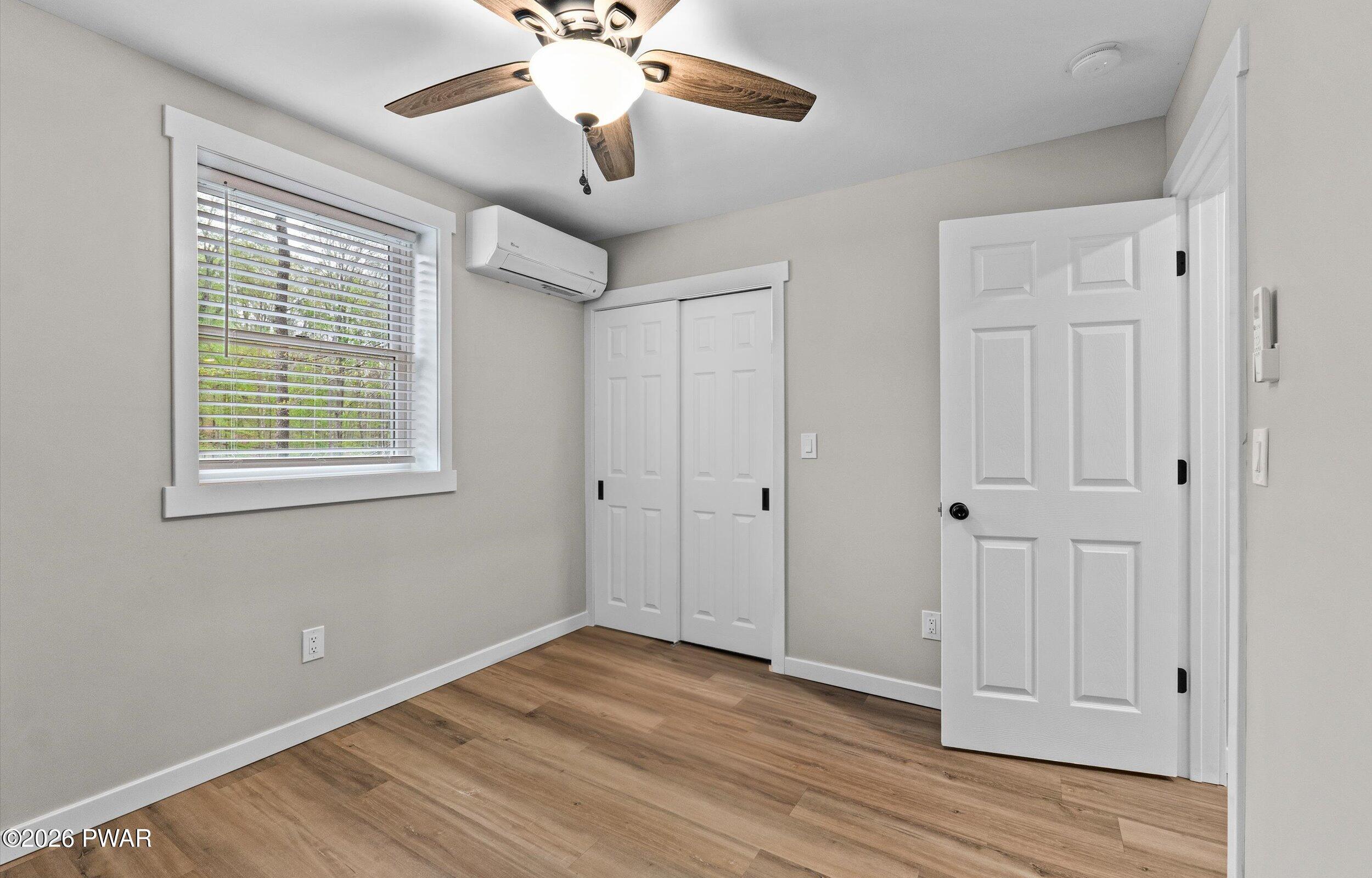 9 High Point Court Lake Ariel, PA 18436 - Photo 20 of 40 a view of an empty room with wooden floor and a window