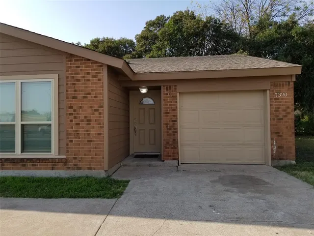 a side view of a house with garage