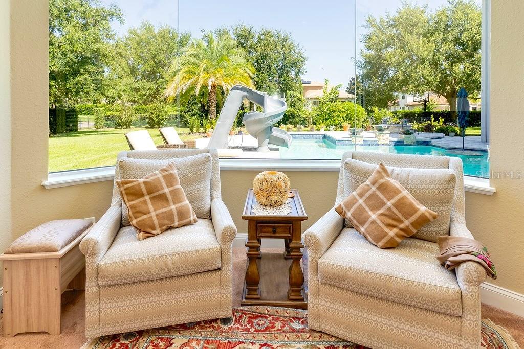 13448 Bellaria Circle Windermere, FL 34786 - Photo 21 of 66 a outdoor living space with furniture and garden view