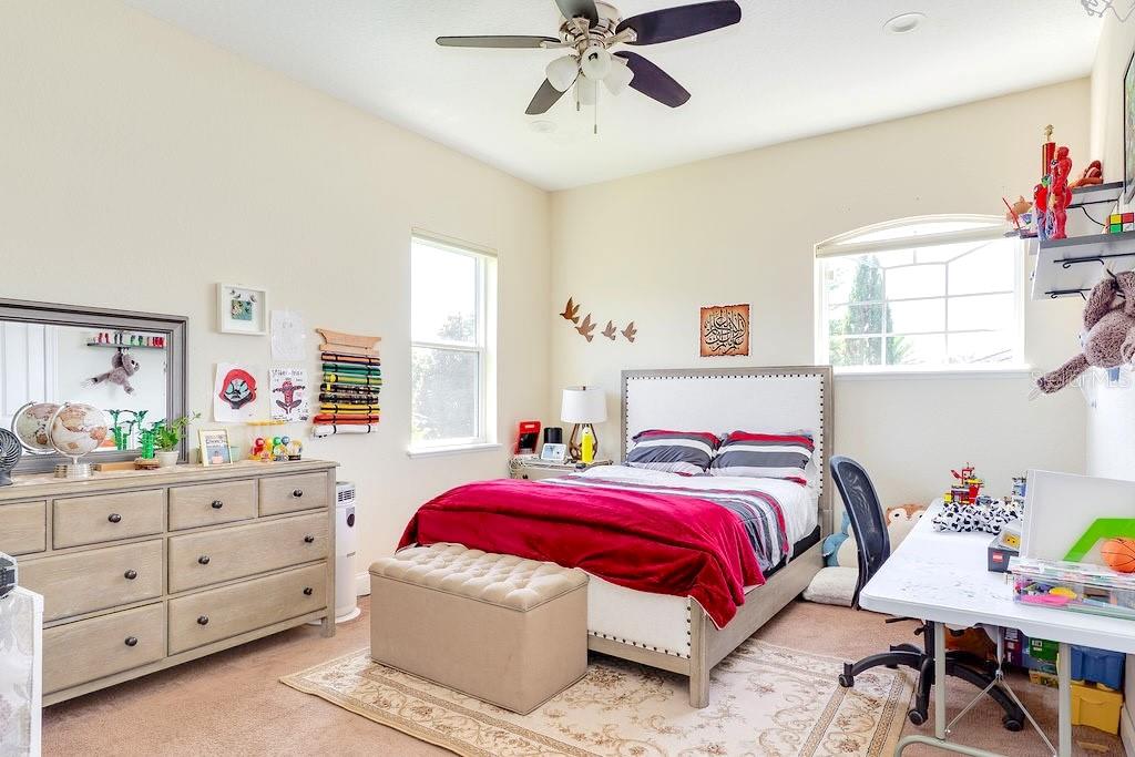 13448 Bellaria Circle Windermere, FL 34786 - Photo 31 of 66 a bedroom with a bed and a dresser in it