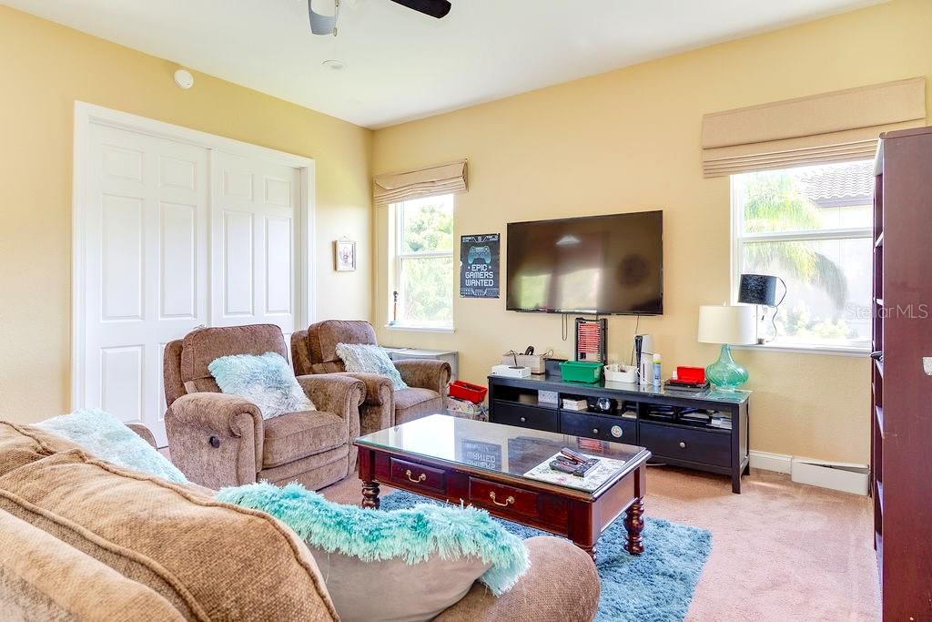 13448 Bellaria Circle Windermere, FL 34786 - Photo 38 of 66 a living room with furniture and a flat screen tv