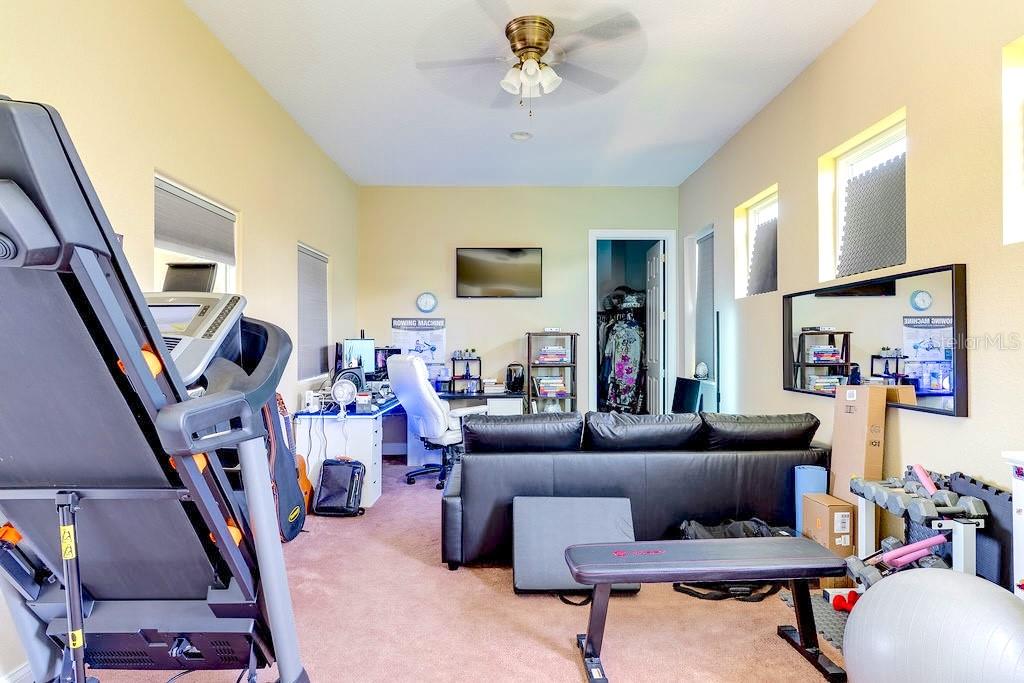 13448 Bellaria Circle Windermere, FL 34786 - Photo 39 of 66 a living room with furniture and a flat screen tv