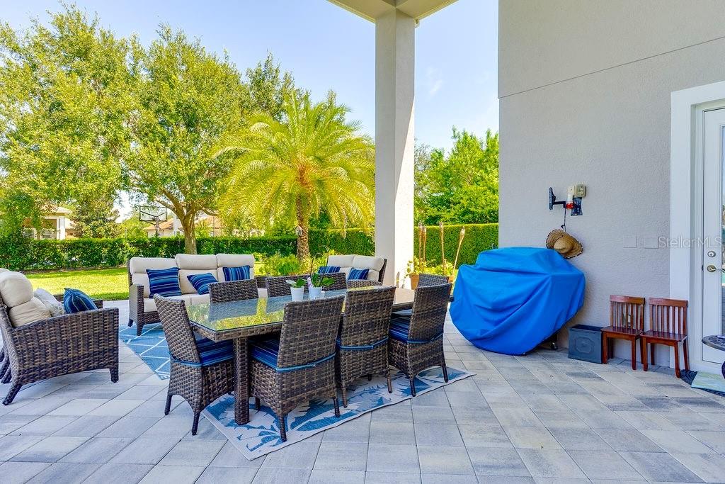 13448 Bellaria Circle Windermere, FL 34786 - Photo 41 of 65 a view of a porch with furniture and a yard