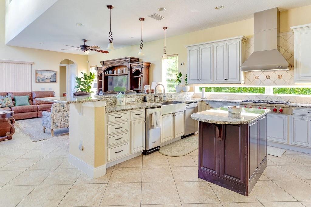 13448 Bellaria Circle Windermere, FL 34786 - Photo 9 of 66 a kitchen with a sink stove and cabinets