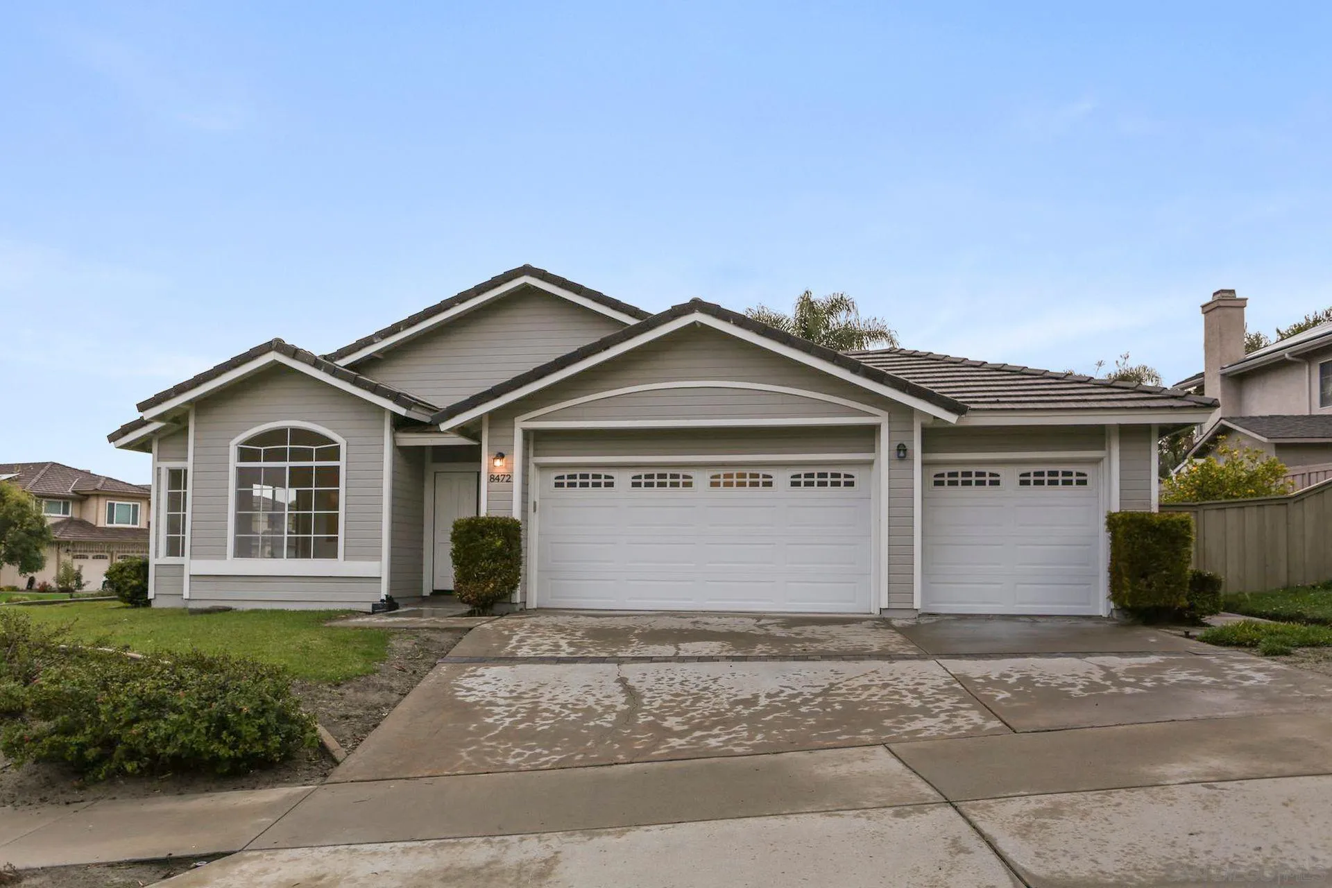 8472 Mesa Heights Road Santee, CA 92071 - Photo 1 of 34 a front view of a house with a yard and garage