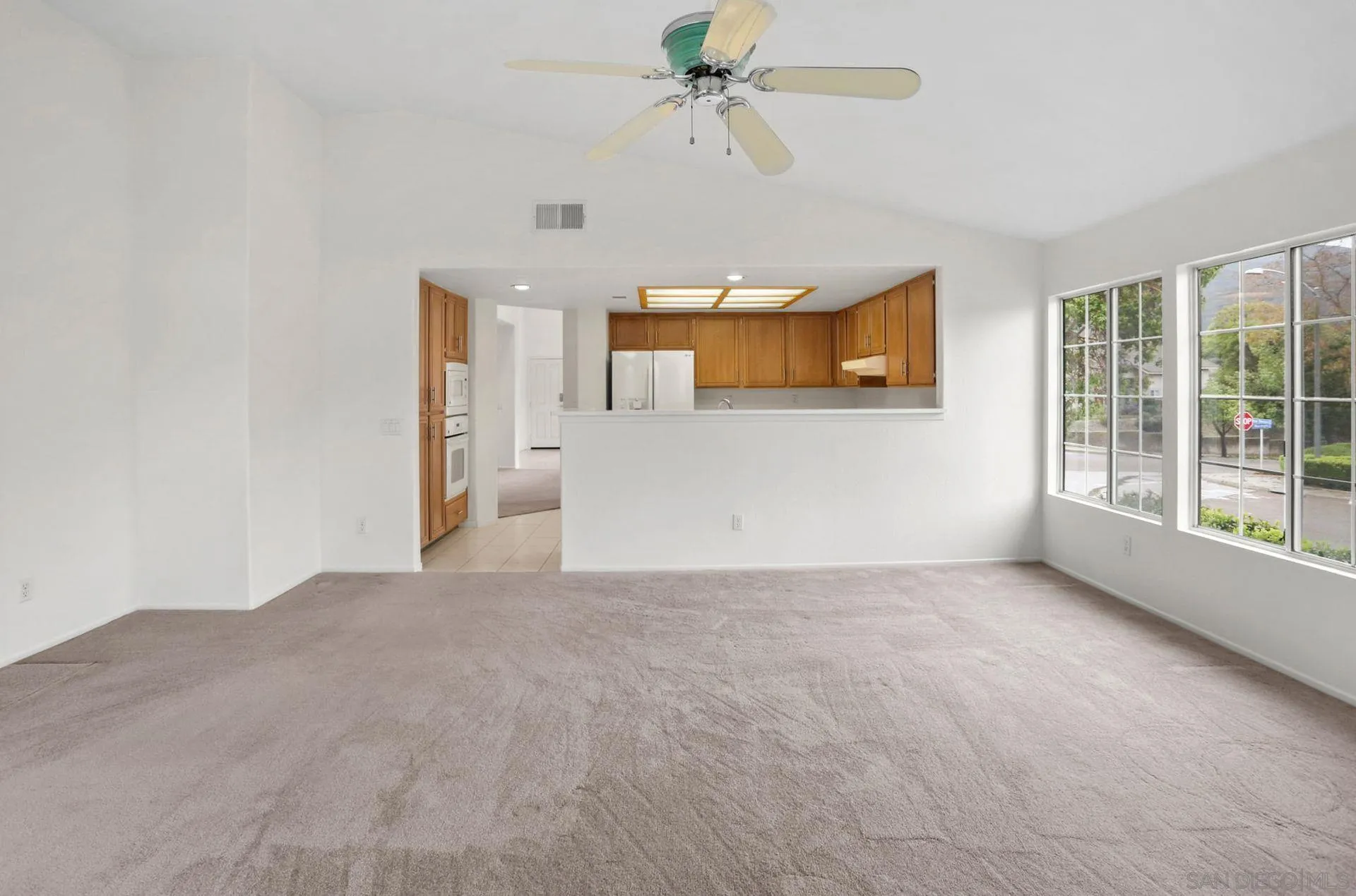 8472 Mesa Heights Road Santee, CA 92071 - Photo 14 of 34 a view of a room with a ceiling fan and window