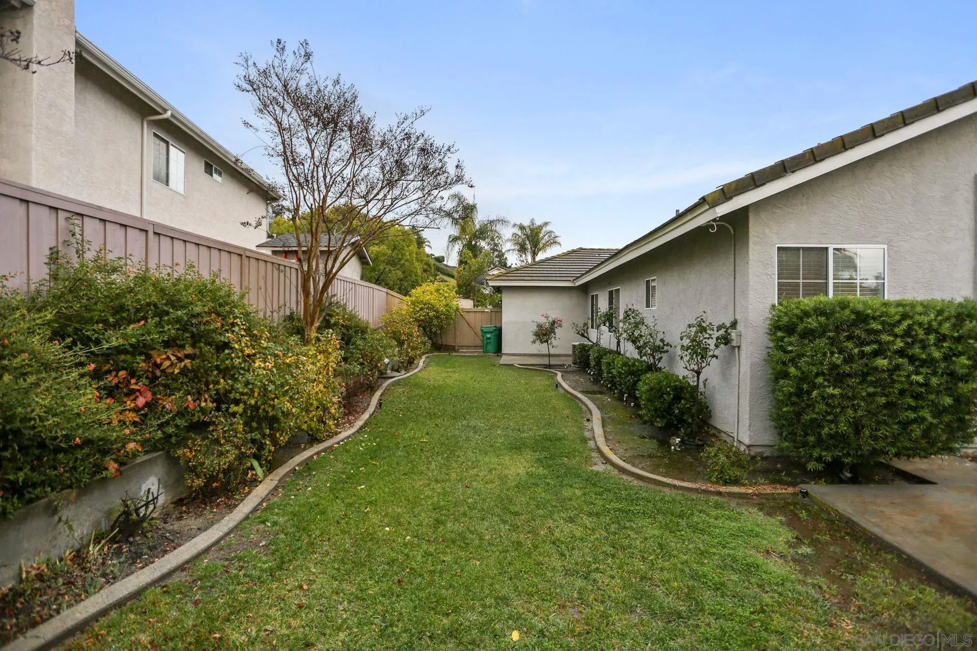 8472 Mesa Heights Road Santee, CA 92071 - Photo 31 of 34 a front view of a house with garden