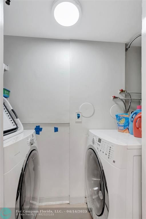 899 Jeffery Street, Unit 109 Boca Raton, FL 33487 - Photo 13 of 37 a utility room with dryer and washer