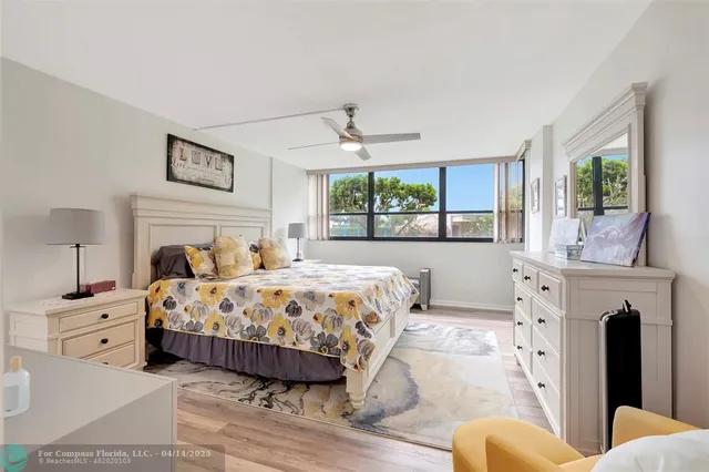 a bedroom with a large bed and a fireplace