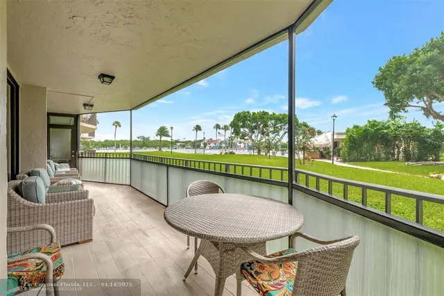 a balcony with furniture and a garden