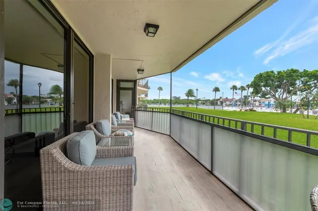a balcony with furniture and garden view
