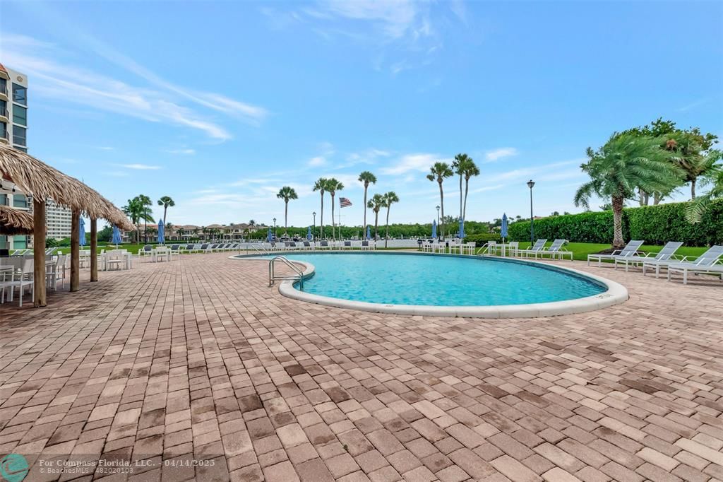 899 Jeffery Street, Unit 109 Boca Raton, FL 33487 - Photo 27 of 37 a view of a swimming pool and a yard