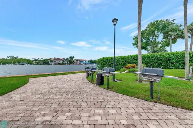 a view of a garden with sitting area