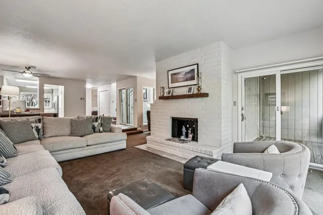a kitchen with granite countertop a refrigerator and a sink