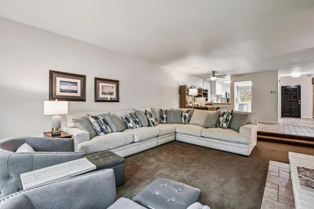 a kitchen with a stove a sink and a refrigerator
