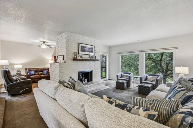 a kitchen with a stove sink and cabinets