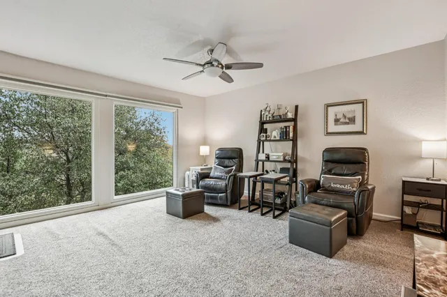 an aerial view of a house with a garden and mountain view in back