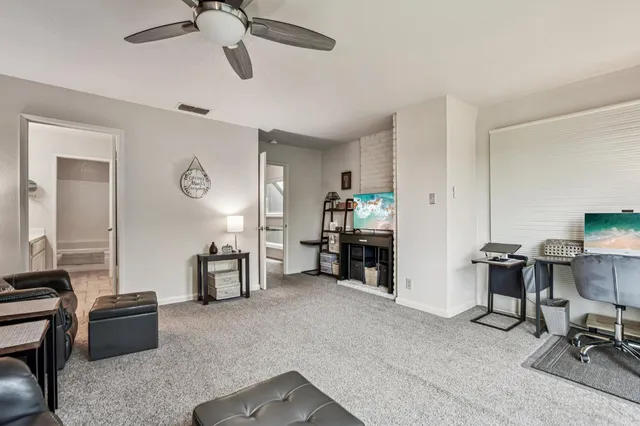 a room with wooden floor and outdoor view
