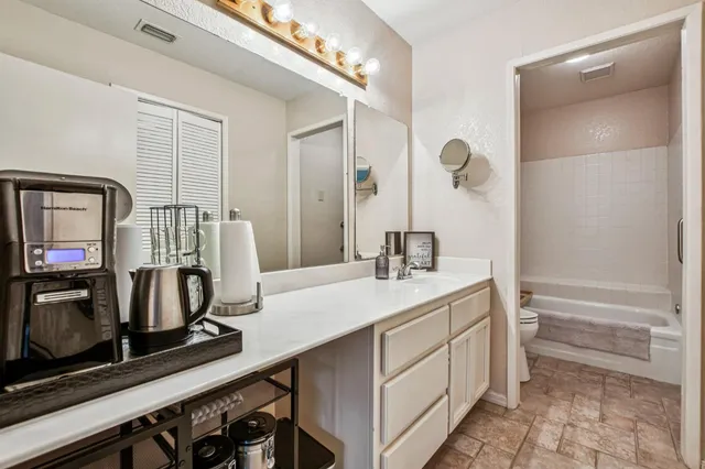 a view of a hallway with washer and dryer