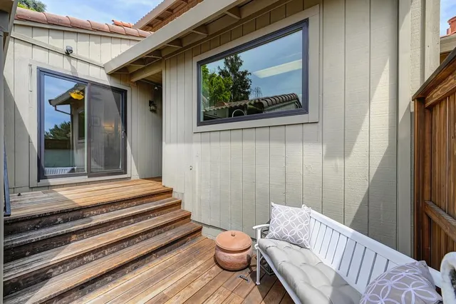 a large kitchen with kitchen island granite countertop a refrigerator and a sink