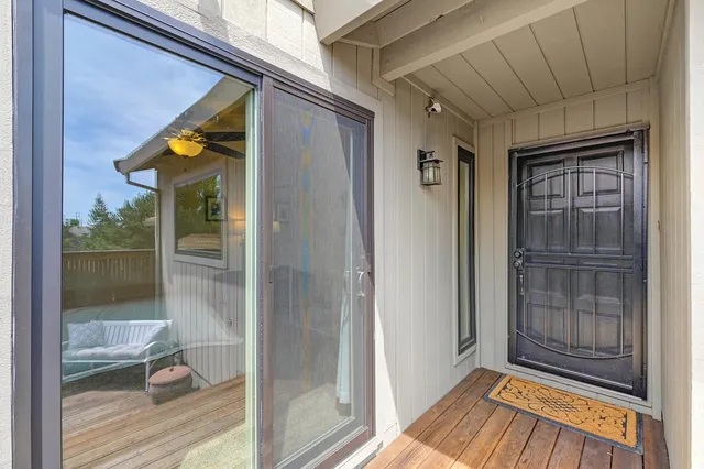 a living room with furniture and a book shelf