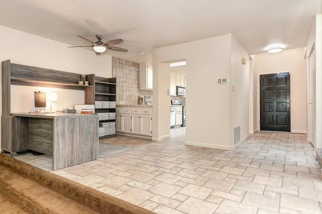 a living room with furniture and a couch