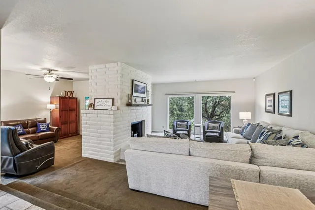 a balcony with furniture and a gate