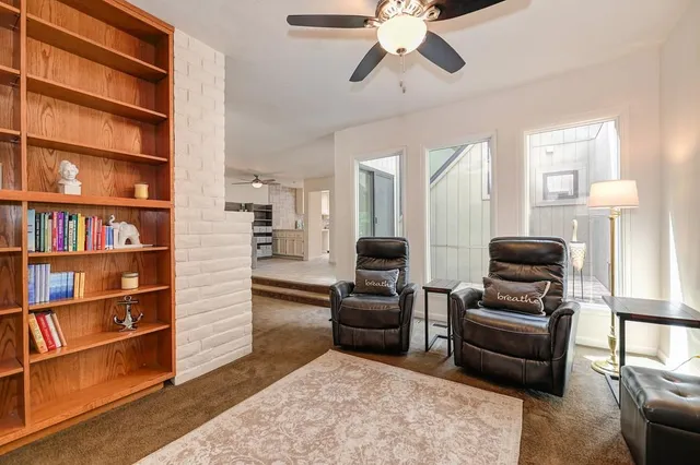 a kitchen with granite countertop white cabinets and appliances