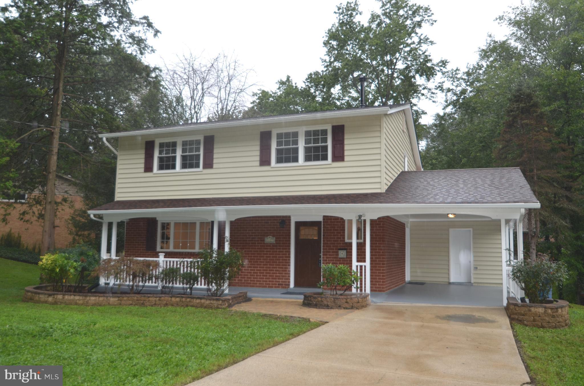 8627 Victoria Road Springfield, VA 22151 - Photo 1 of 30 front view of a house and a yard
