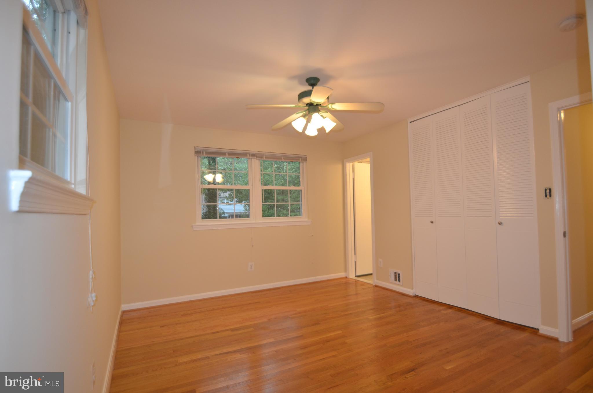 8627 Victoria Road Springfield, VA 22151 - Photo 14 of 30 a view of an empty room with a window