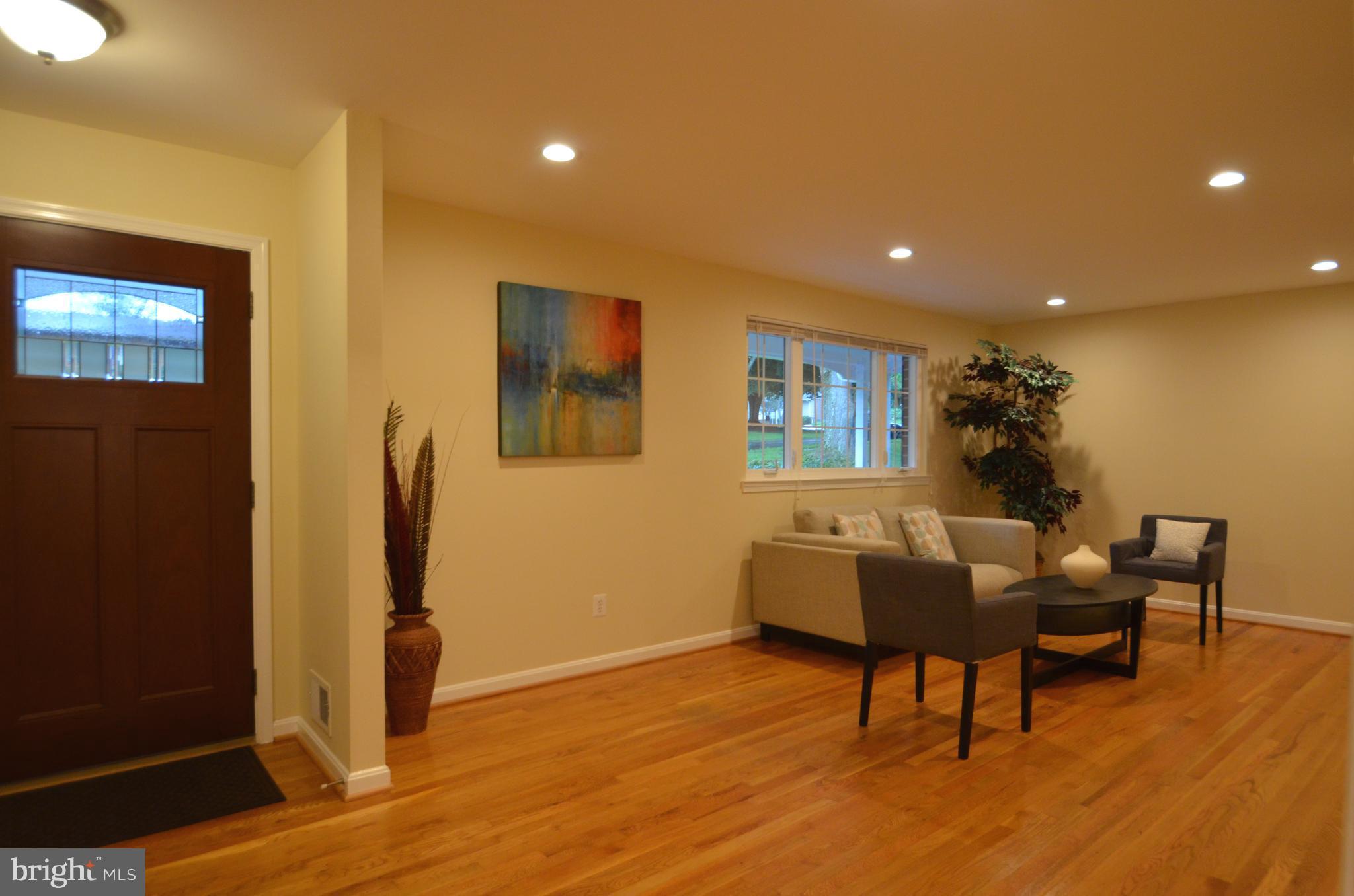 8627 Victoria Road Springfield, VA 22151 - Photo 3 of 30 a living room with furniture and a wooden floor