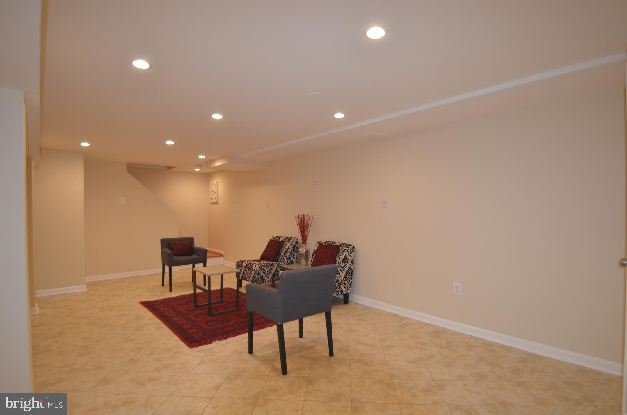 8627 Victoria Road Springfield, VA 22151 - Photo 21 of 30 a living room with furniture and a table