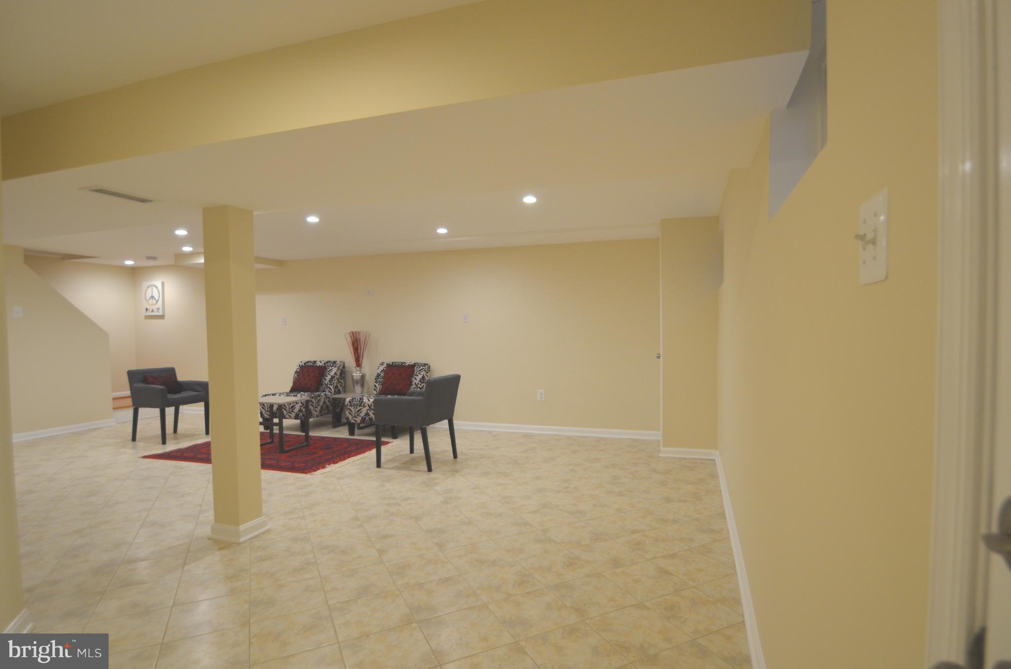 8627 Victoria Road Springfield, VA 22151 - Photo 23 of 30 a living room with furniture and a table