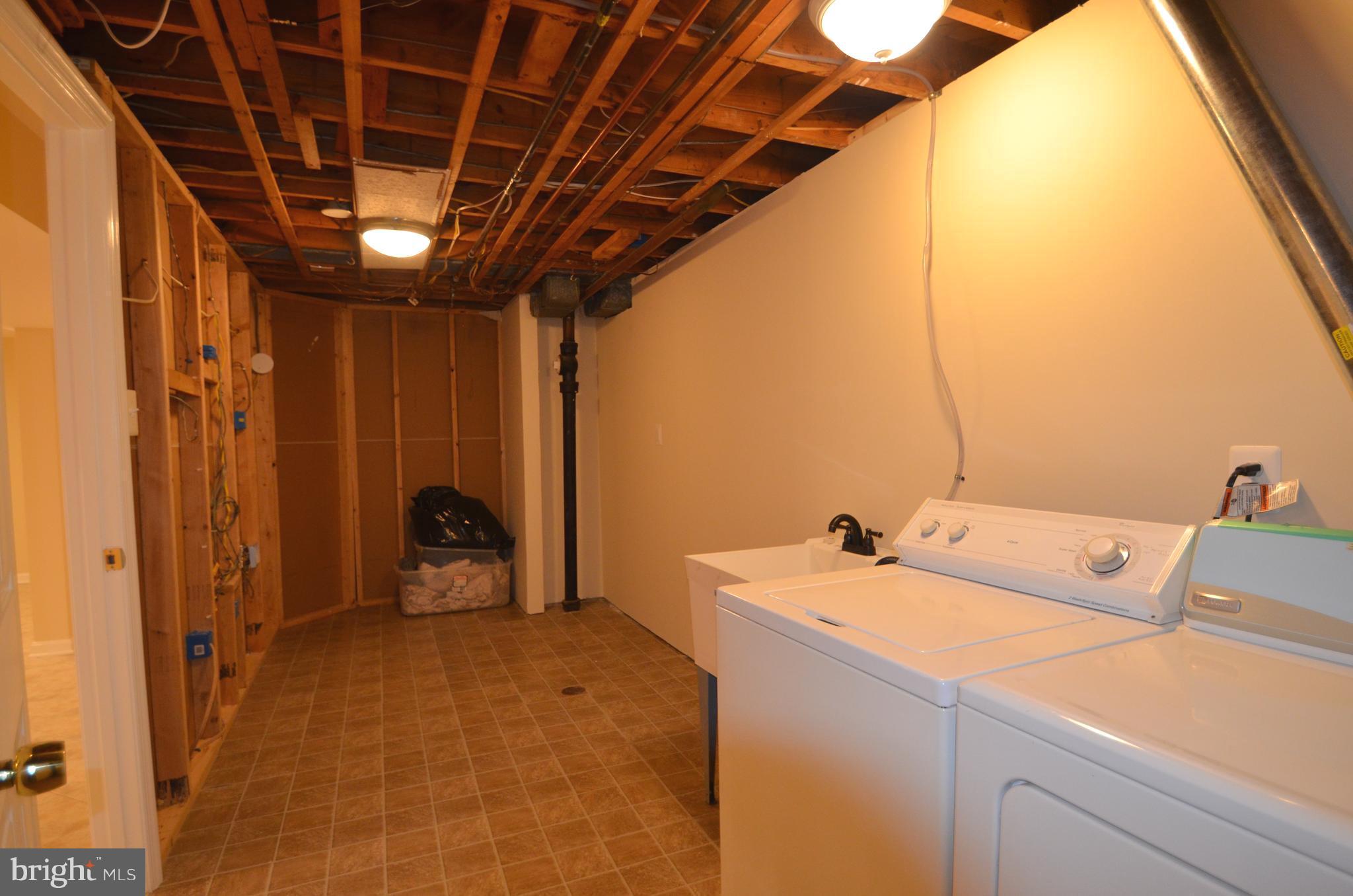 8627 Victoria Road Springfield, VA 22151 - Photo 24 of 30 a utility room with dryer and washer