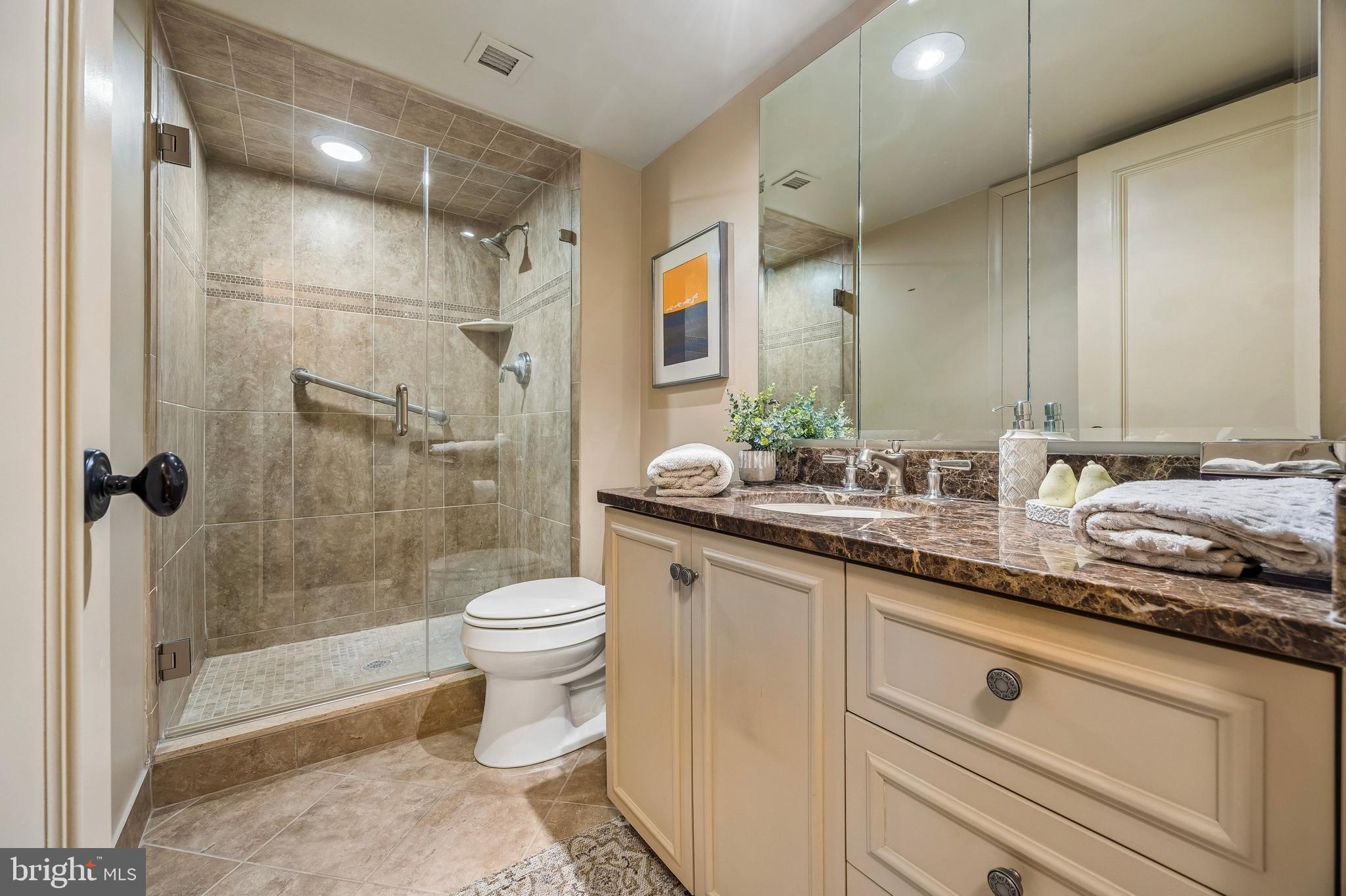 41 Conshohocken State Road, Unit 603 Bala Cynwyd, PA 19004 - Photo 12 of 37 a bathroom with a granite countertop sink a toilet and shower