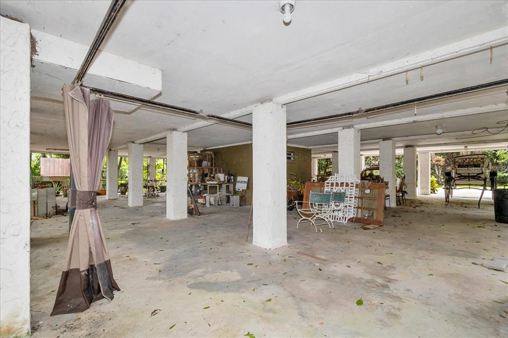 35 Magnolia Avenue Yankeetown, FL 34498 - Photo 12 of 75 a view of a room with gym equipment and large windows