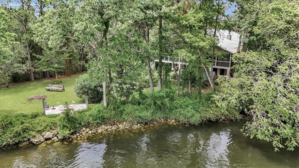 35 Magnolia Avenue Yankeetown, FL 34498 - Photo 2 of 75 an aerial view of a house with a yard and lake view