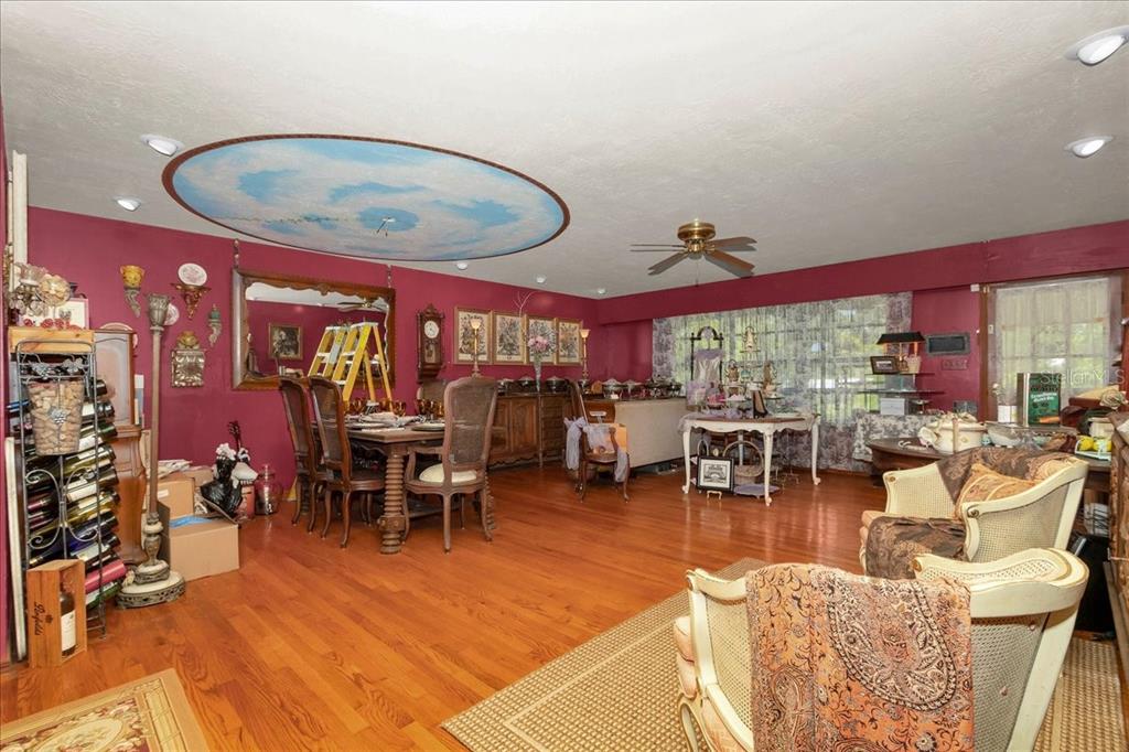 35 Magnolia Avenue Yankeetown, FL 34498 - Photo 21 of 75 a view of a dining room with furniture one side kitchen view and wooden floor