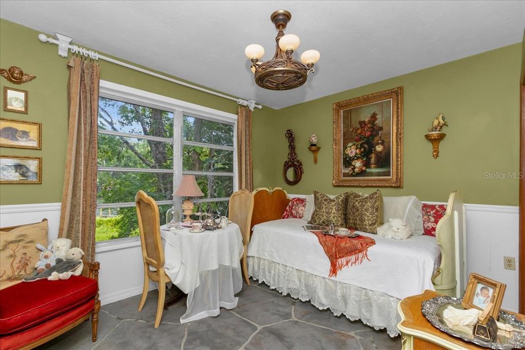 35 Magnolia Avenue Yankeetown, FL 34498 - Photo 23 of 75 a living room with furniture and a large window