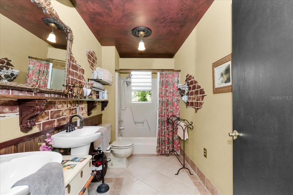 35 Magnolia Avenue Yankeetown, FL 34498 - Photo 25 of 75 a bathroom with a sink toilet and shower