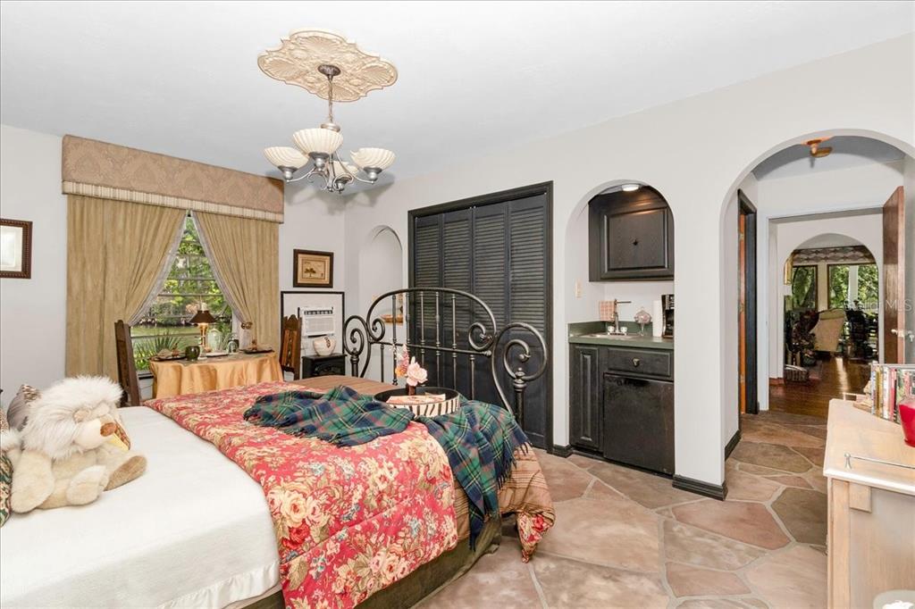35 Magnolia Avenue Yankeetown, FL 34498 - Photo 29 of 75 a bedroom with bed and a chandelier