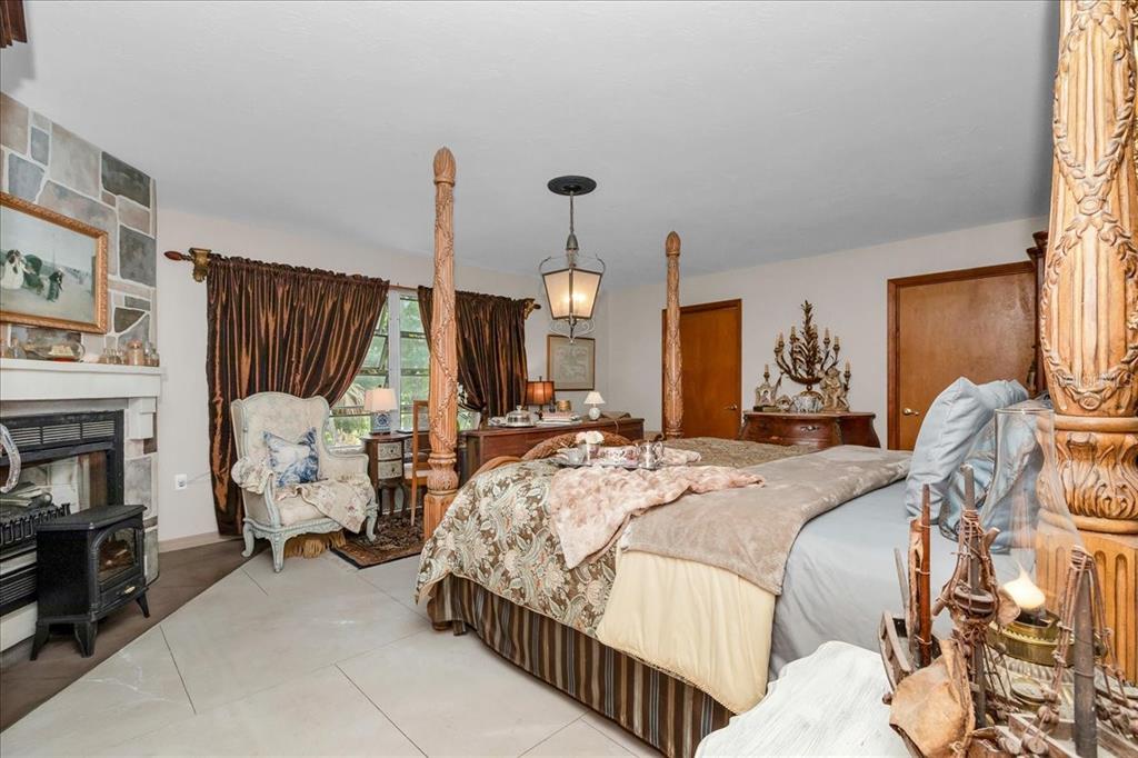 35 Magnolia Avenue Yankeetown, FL 34498 - Photo 31 of 75 a bed room with a bed and a chair